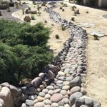 Low maintenance Using Decomposed Granite And an artificial water river channel