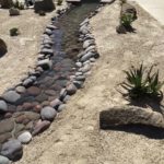 Low maintenance Using Decomposed Granite And an artificial water river channel